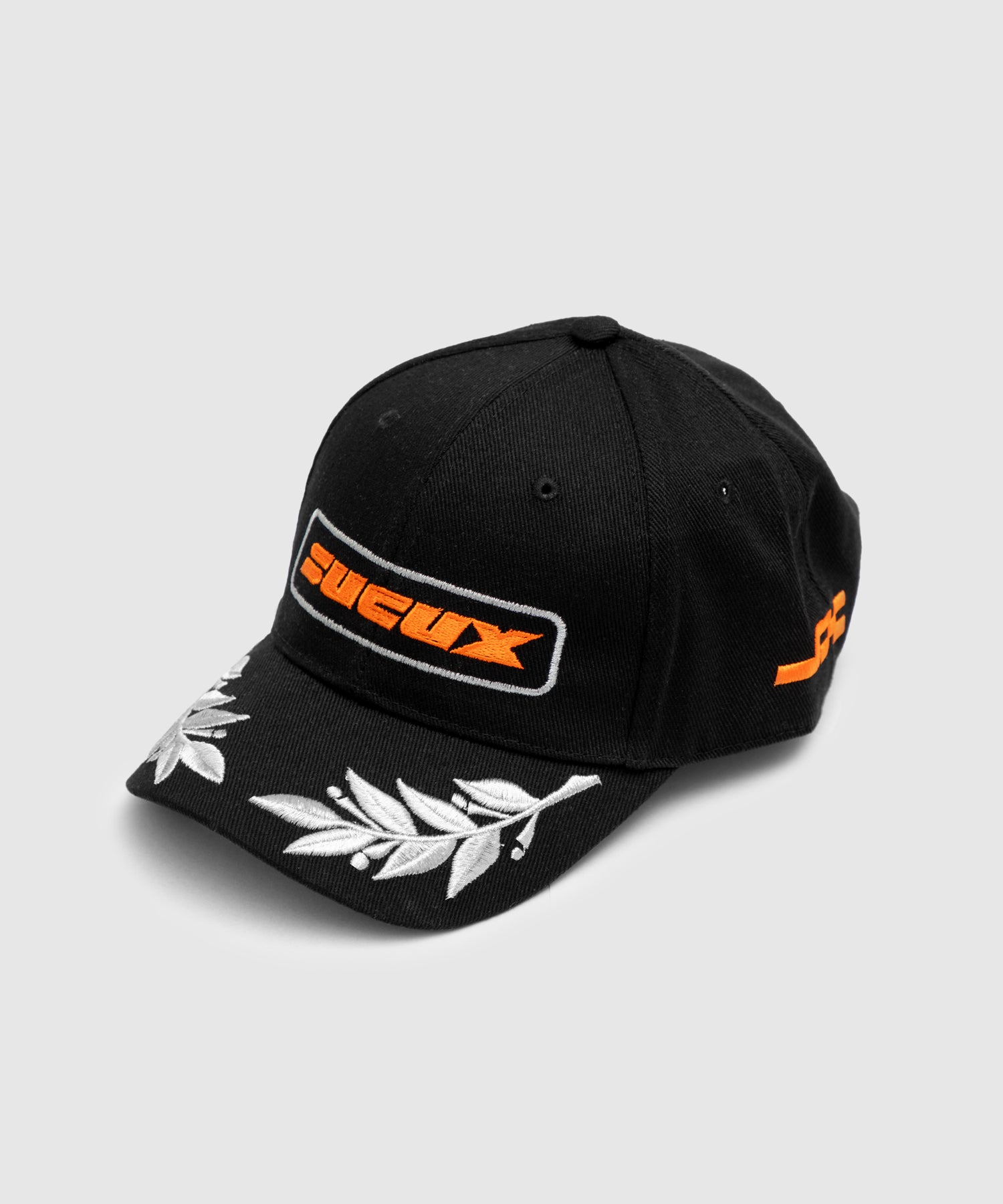 Black baseball cap featuring an orange embroidered "SUCUX" logo on the front, white laurel leaf embroidery on the brim, and additional orange branding on the side.