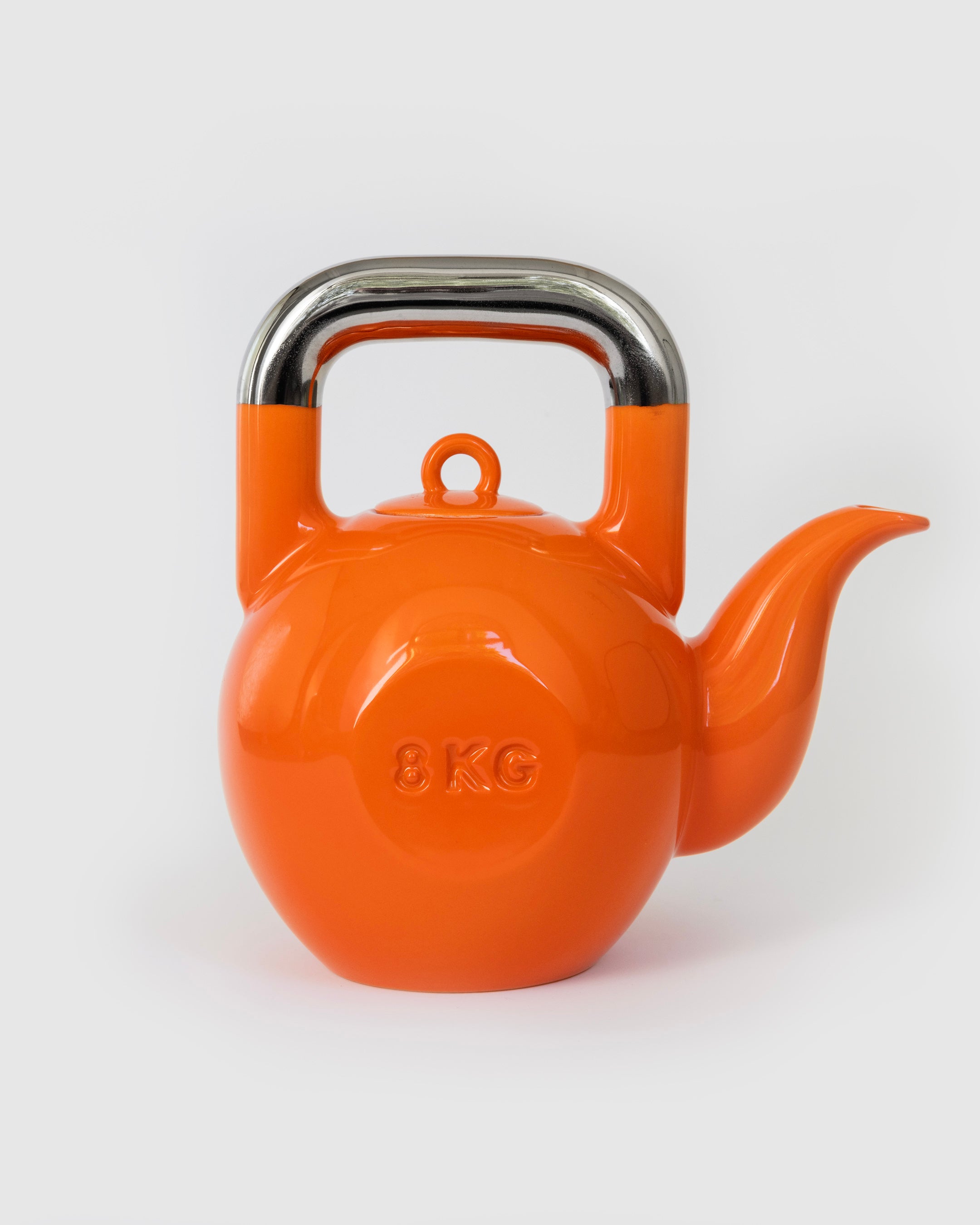 Orange Kettlebell Teapot, front view with platinum handle