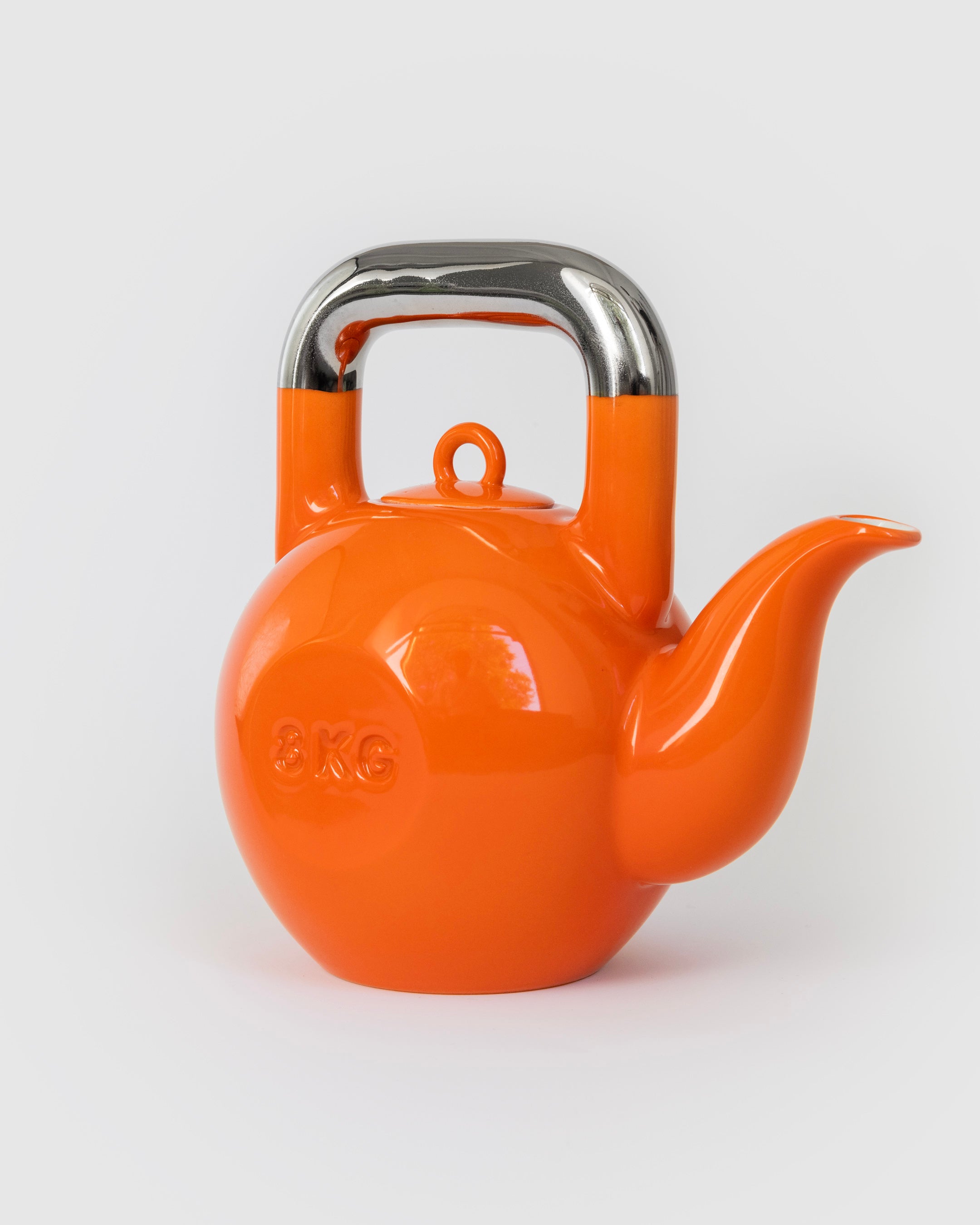 Orange Kettlebell Teapot, side view showing sculptural silhouette